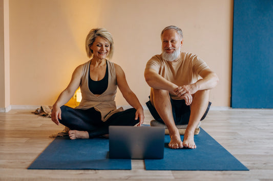 old man and woman in their 50 working out